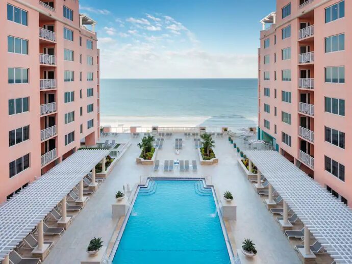 Image of a residential building with a pool